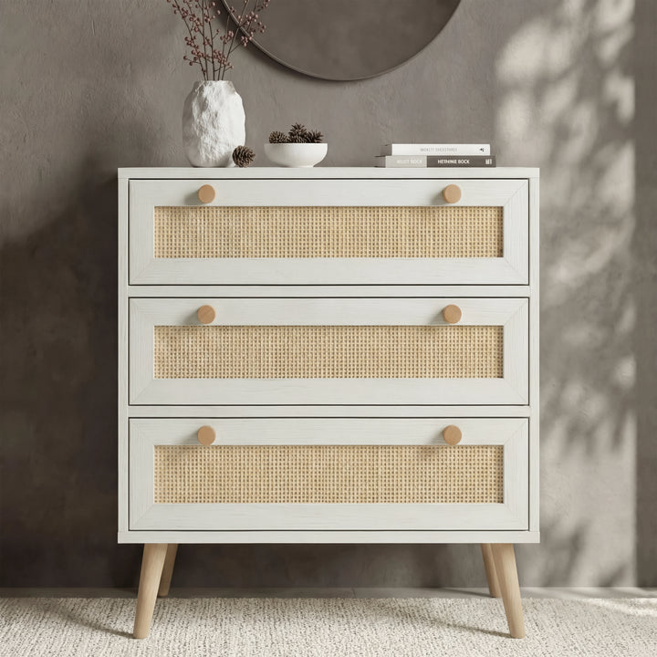 [White] Wovena rattan bedroom furniture set chest of drawers styled with vase, pinecones and round mirror