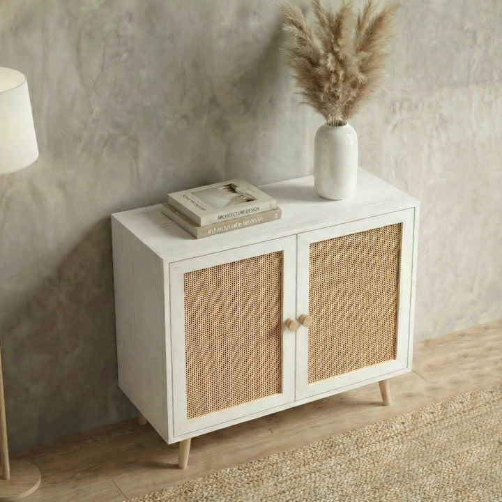 [White] Wovena sideboard in textured grey room, rattan door panels facing camera with floor lamp framing left edge