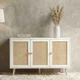 [White] Wovena Rattan 3 Door Sideboard - Adjustable Shelf White straight-on view styled with pampas grass against a concrete wall.