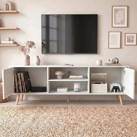 [White] Wovena Rattan TV Unit with both doors open showing vinyl records, soundbar, Apple TV, smart speaker, fabric box, and game controllers
