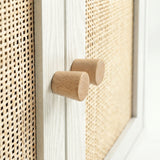 [White] Wovena sideboard close-up of two cylindrical beech knobs aligned at the centre meeting stiles