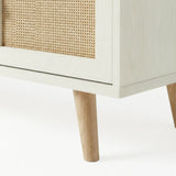 [White] Wovena close-up of natural oak tapered leg and rattan cane panel edge detail against a white background