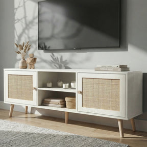 [White] Wovena lifestyle angled view with dried pampas, stacked books, and woven basket beneath a wall-mounted TV
