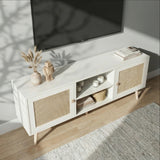 [White] Wovena top-down lifestyle angle with dried pampas, stacked books, and candles beneath a wall-mounted TV