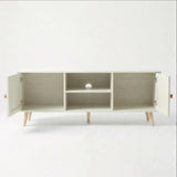 [White] Wovena open storage view with both rattan doors swung open, showing internal shelves, cable hole, and oak legs