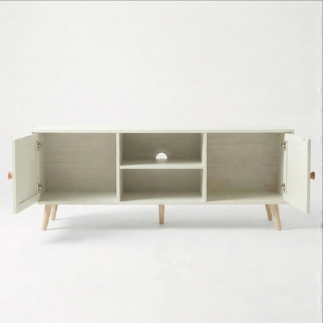 [White] Wovena open storage view with both rattan doors swung open, showing internal shelves, cable hole, and oak legs