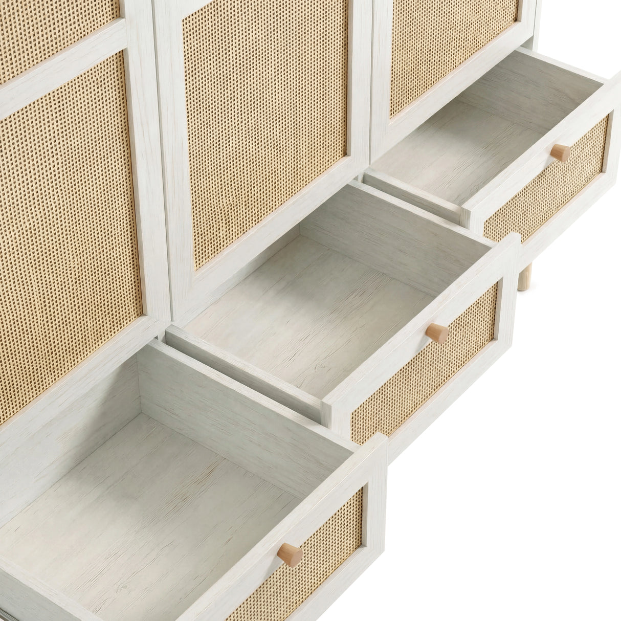 [White] rattan 3 door wardrobe with all three base drawers pulled fully open showing white melamine interior