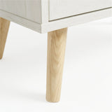 [White] Wovena wardrobe leg detail displaying solid pine construction and mid-century profile