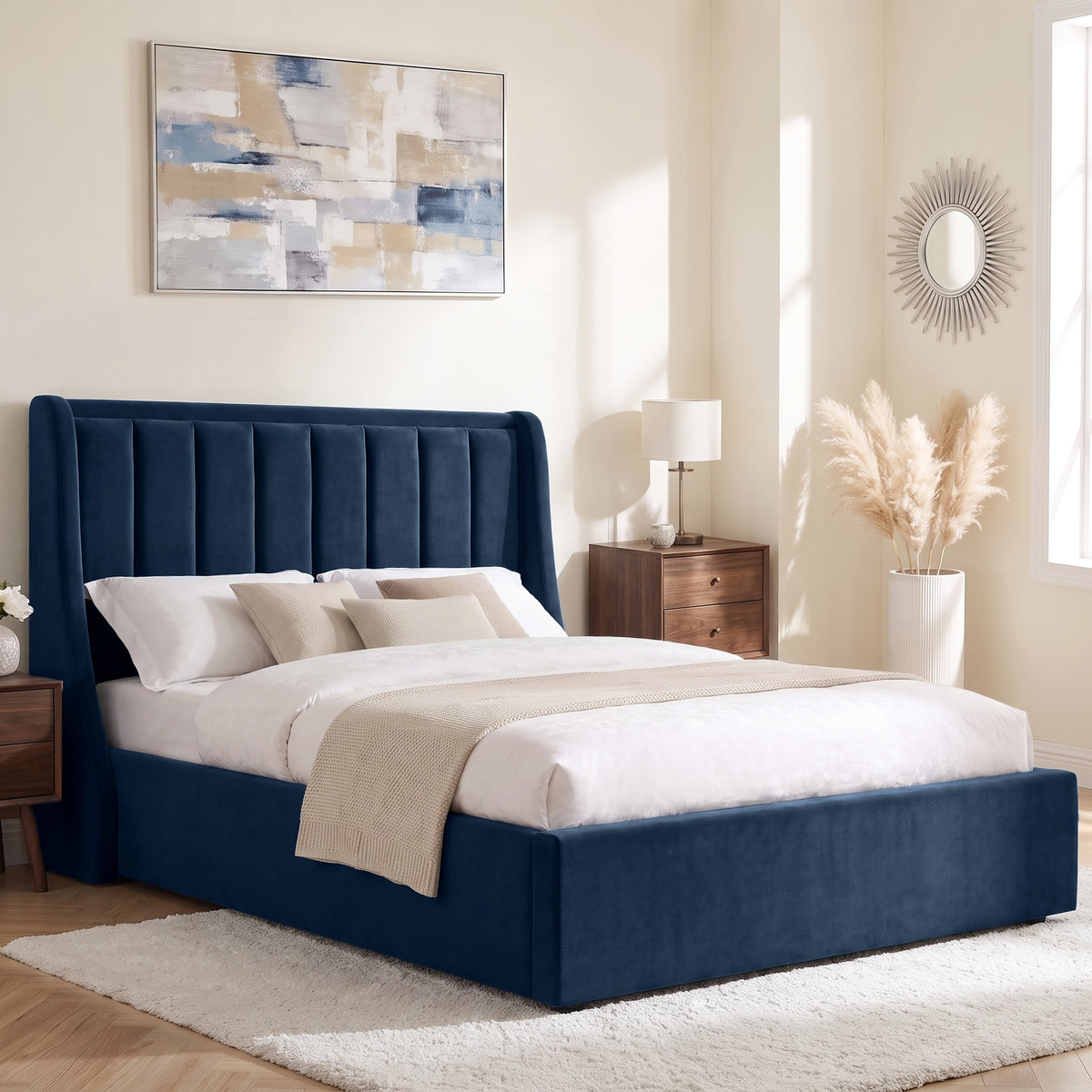 [Blue | King] Winged ottoman storage bed angled room view with winged vertical panel headboard and bedding