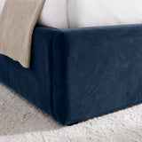 [Blue | King] Close-up of padded footboard corner showing plush fabric and Elevated bed base detail