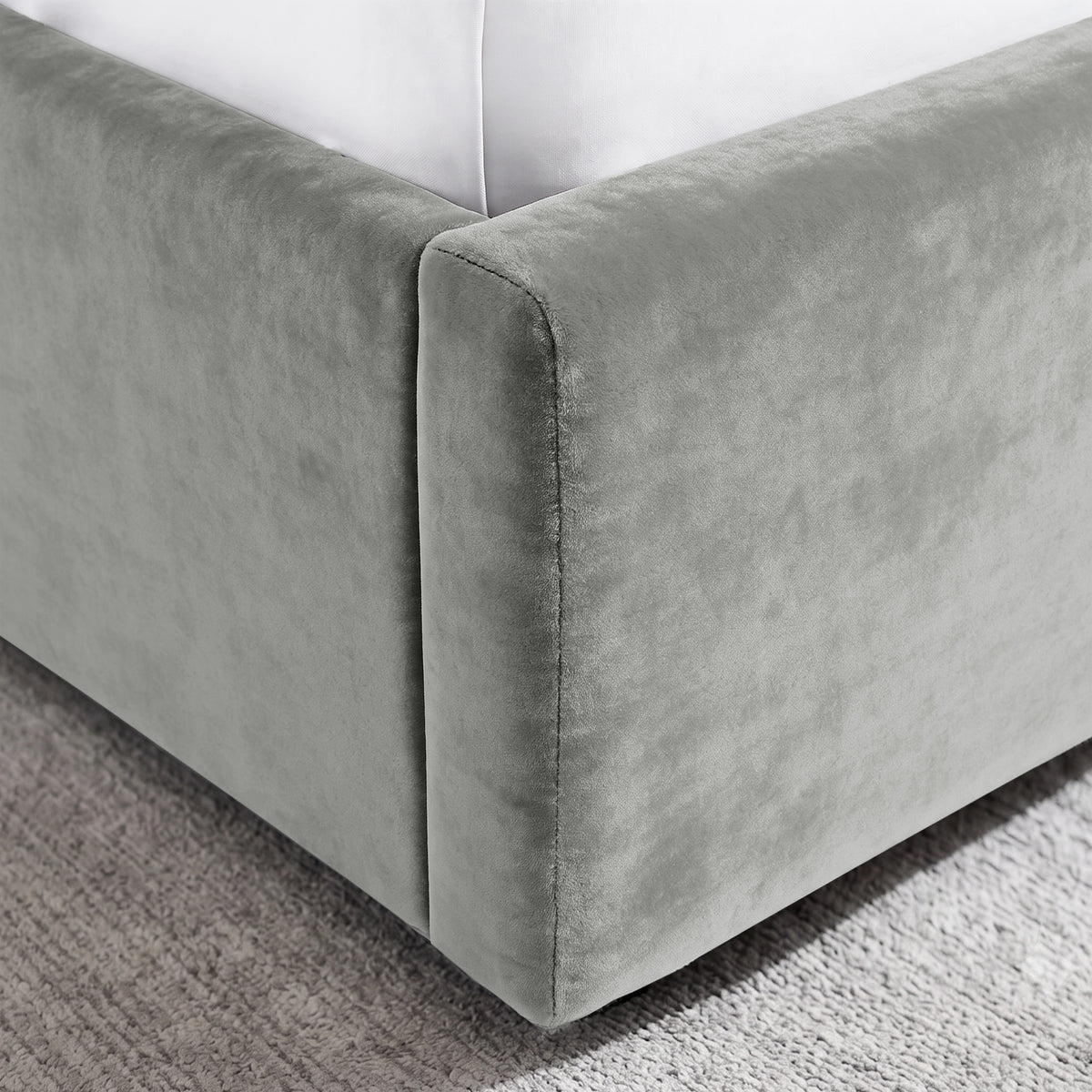 [Light Grey | King] Close-up of padded footboard corner showing plush fabric and Elevated bed base detail