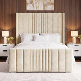 [King | Beige] upholstered bed frame with a tall, vertically channel-tufted headboard and matching footboard, styled in a modern bedroom setting with white bedding, white nightstands, and a dark wood-paneled wall.