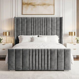 [King | Grey] velvet bed frame with a tall, channel-tufted headboard and matching footboard, styled in a contemporary bedroom with white bedding, white nightstands, gold lamps, and a neutral wall paneling.