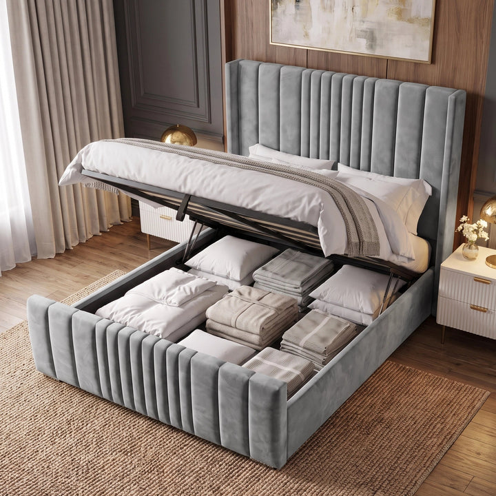 [King | Light Grey] upholstered bed frame with a matching headboard and footboard, styled in a modern bedroom setting with a matching ottoman, gray rug, wooden floor, and neutral decor.