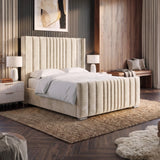 [Double | Beige] Winged ottoman bed upholstered bed with a tall channel-tufted headboard and matching footboard, styled in a modern bedroom with dark wood floors, a woven rug, bedside tables, lamps, and wall art.
