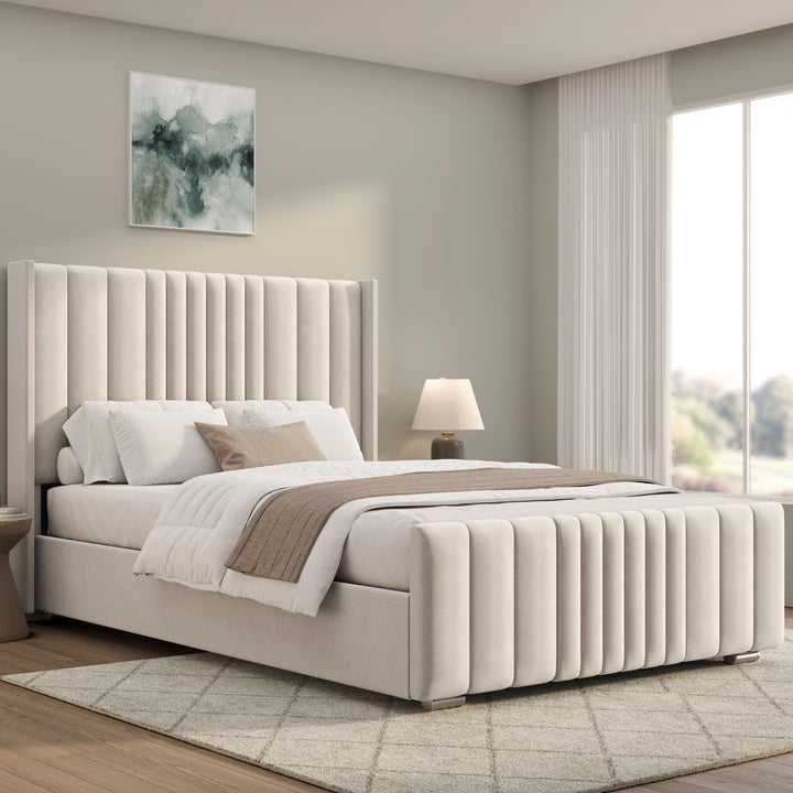 [Double | Beige] Ottoman bed from the side with tall winged headboard deep vertical fluted channels