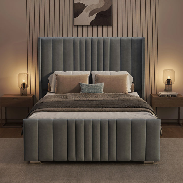[Double | Grey] Front view of winged ottoman bed at night with vertical channel headboard and warm ambient lamps