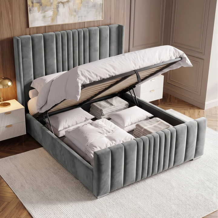 [Double | Grey] Ottoman bed lifted open from above revealing deep gas-lift storage with folded duvets and pillows