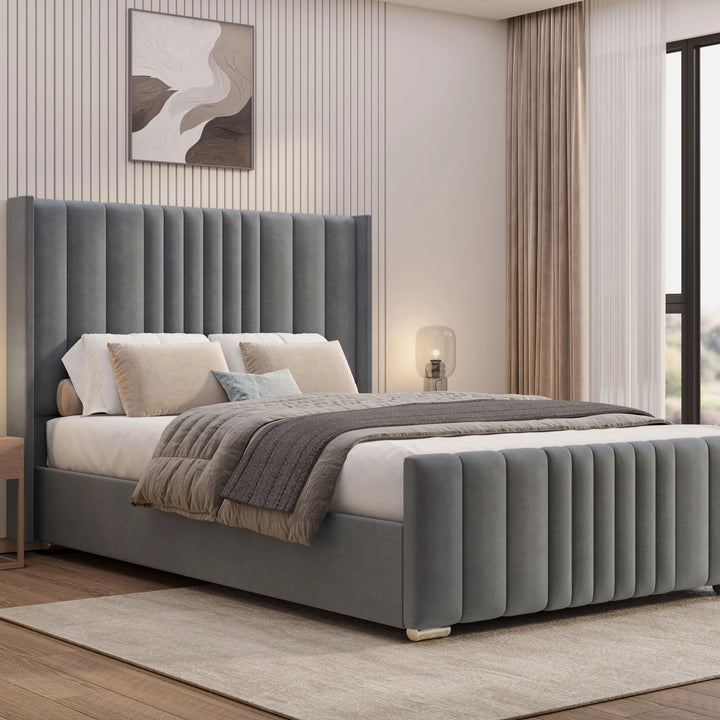 [King | Grey] Side angle of winged ottoman bed with vertical channel-stitched headboard and matching footboard