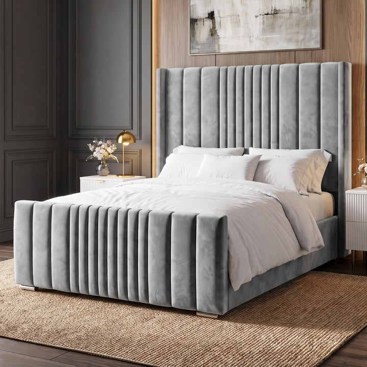 [King | Light Grey] Side angle of winged ottoman bed with vertical channel-stitched headboard and matching footboard