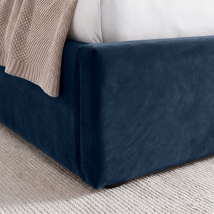 [Blue | Double] Close-up of padded footboard corner showing plush fabric and Elevated bed base detail
