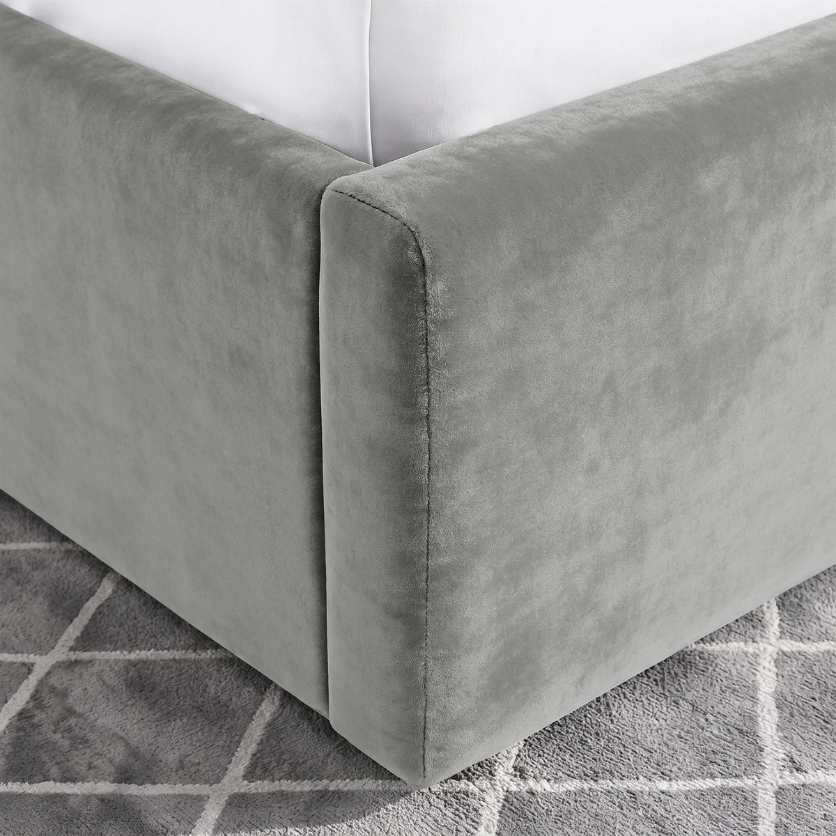 [Light Grey | Double] Close-up of padded footboard corner showing plush fabric and Elevated bed base detail