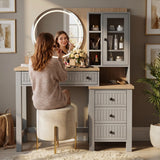 [Grey] Linra Grey Painted Dressing Table with LED Mirror and Storage with a woman sitting on the stool applying makeup.