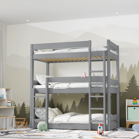 Grey bunk bed in a child's bedroom with a forest mural on the wall.