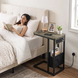 [Wooden Grey]side table beside bed with wooden grey-effect top, charging station, lamp, phone and storage pouch