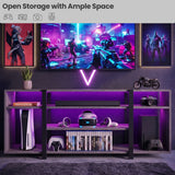 [Wooden Grey] Zelumi TV stand in a dark gaming room with purple LED shelves, consoles, VR headset, soundbar, and neon gaming wall art in the background