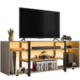 [Wooden Grey] Zelumi TV stand on white background with TV placed on top, warm LED shelves loaded with consoles, VR gear, soundbar and game cases