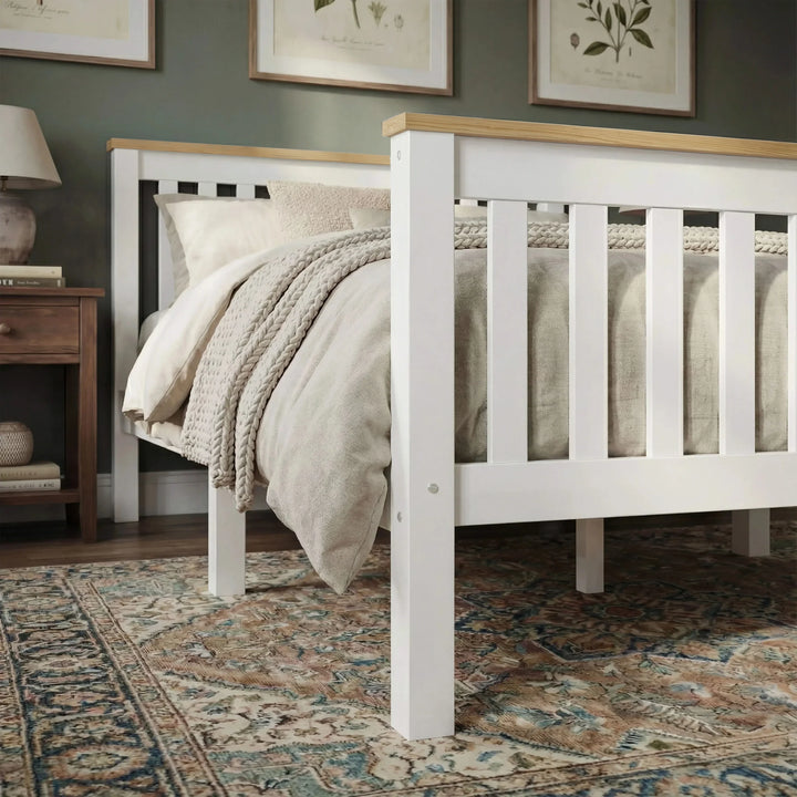 [Single | White + Pine] bed with beige bedding in a bedroom setting