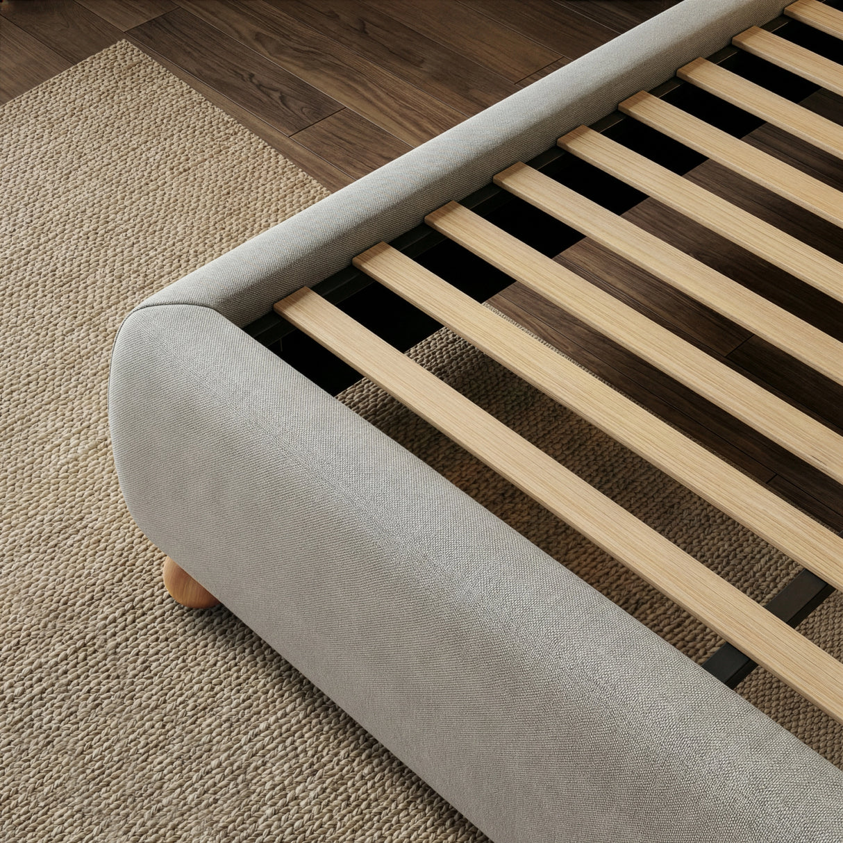 Wooden slat base in a grey double bed frame, displayed for mattress ventilation and even weight support