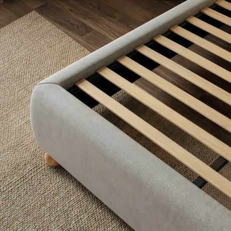 Wooden slat base in a grey double bed frame, displayed for mattress ventilation and even weight support