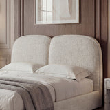 Double bed frame with a soft beige upholstered headboard, complemented by white bedding and a minimalist design