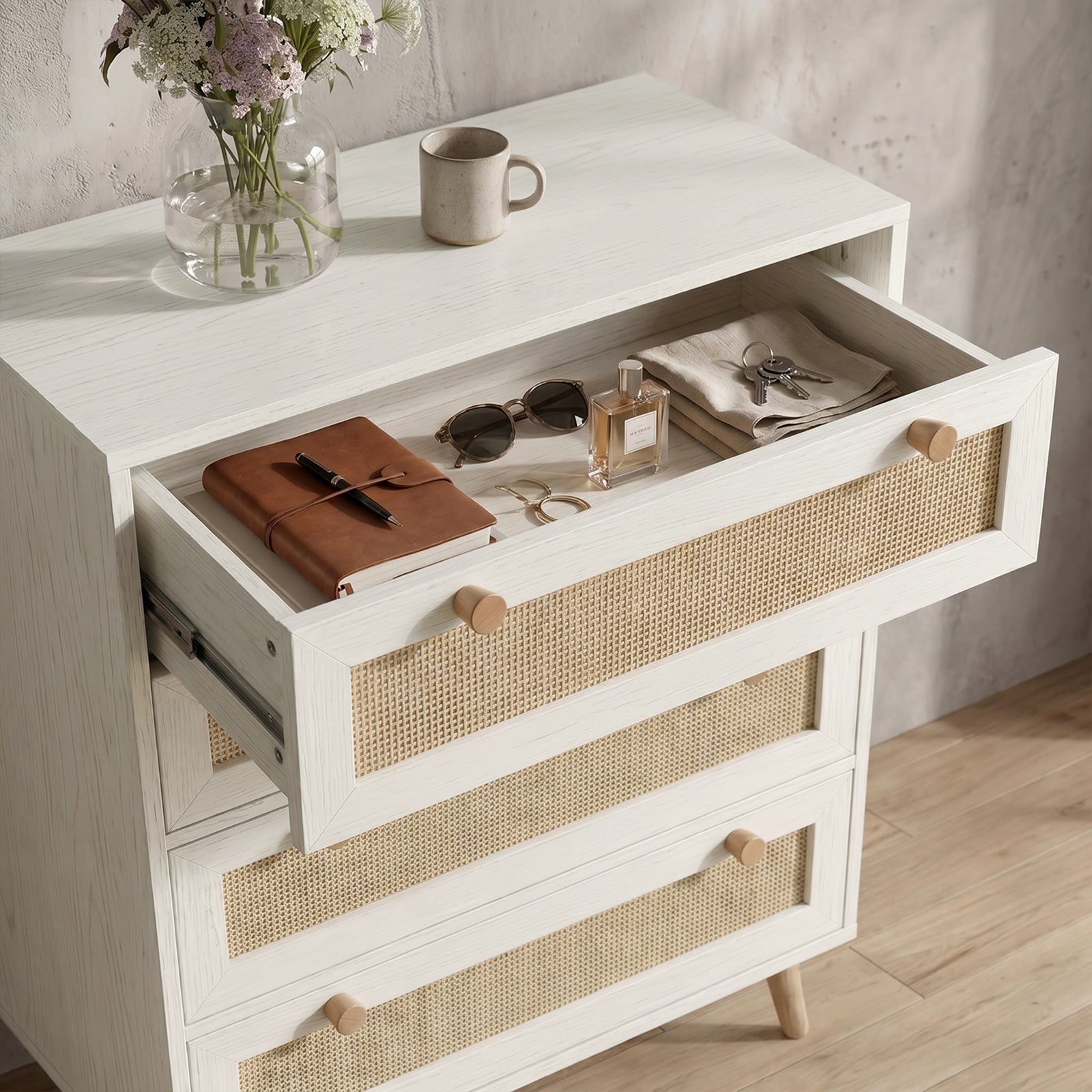 [White] Woven Rattan 4 Drawer Chest of Drawers, White high-angle look focusing on the top drawer open with everyday essentials.