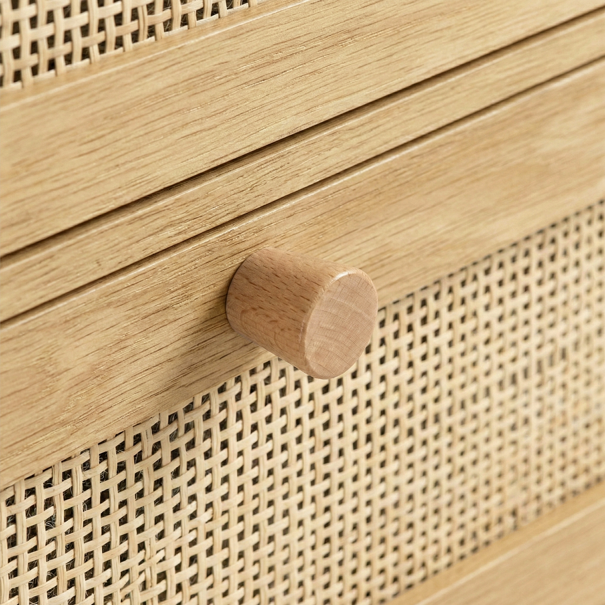 [Oak] Wovena rattan 2 door wardrobe detail: round pine knob on oak frame above cane mesh drawer