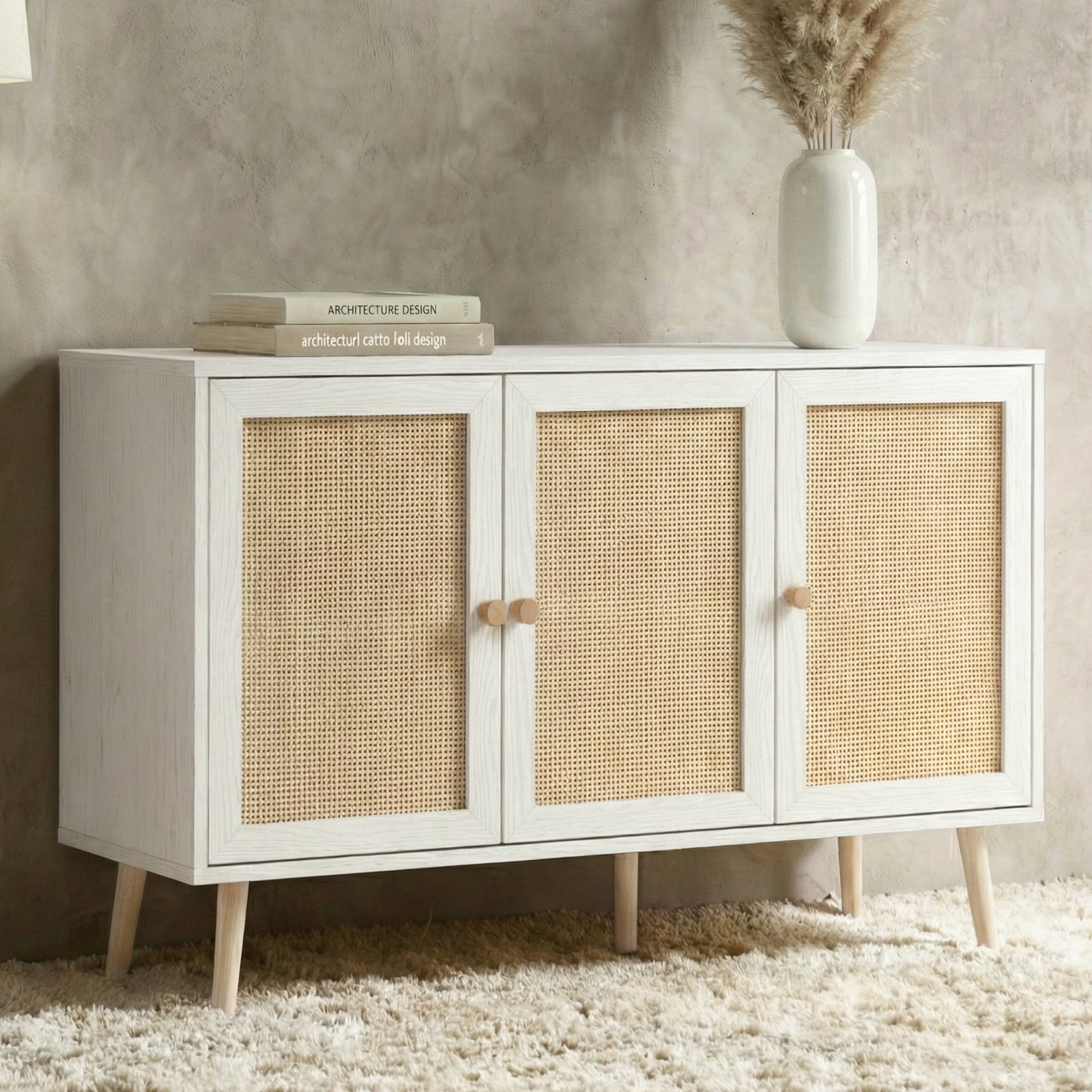 [White] Wovena Rattan 3 Door Sideboard - Adjustable Shelf White shown from an angled perspective in a styled room layout.