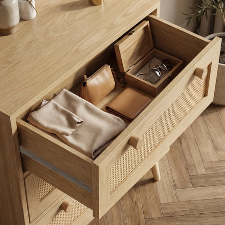 [Oak Effect] Open top drawer detail on Wovena rattan chest of drawers showing organised personal items inside