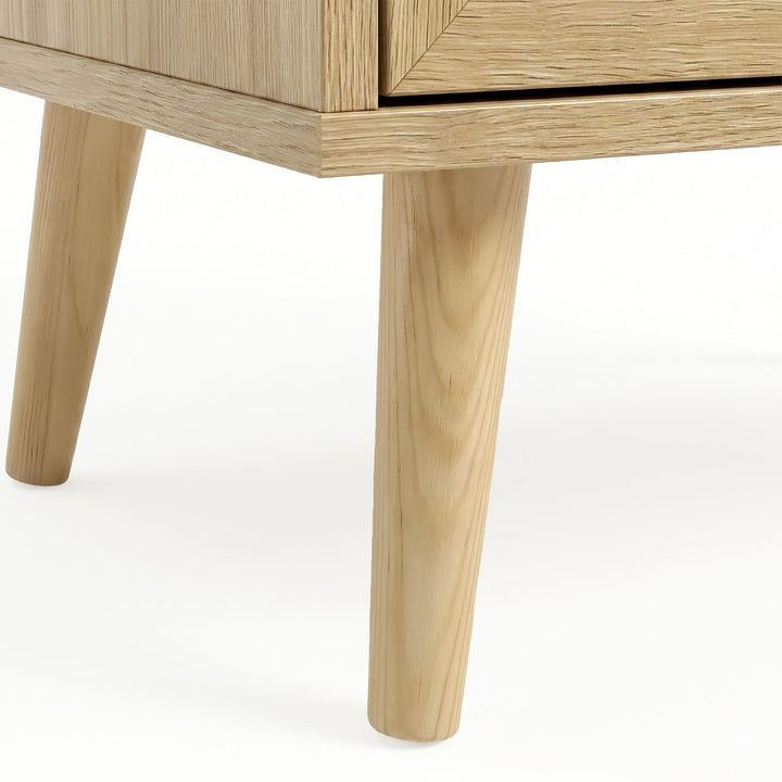 [Oak Effect] Wovena rattan chest of drawers leg detail, two splayed pine legs in light natural finish