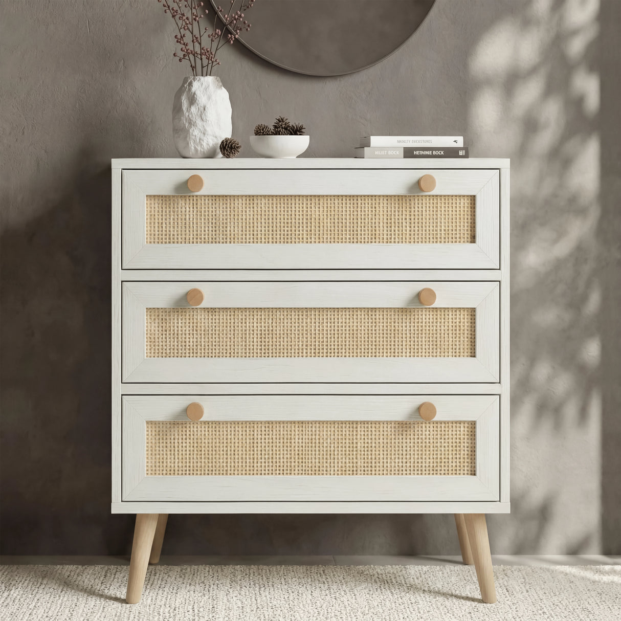 [White] Wovena chest of 3 drawers front view in styled bedroom with round mirror above and decorative objects on top