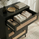 [Black] Wovena 4 drawer chest top drawer open with organised clothing beside books and dried flowers