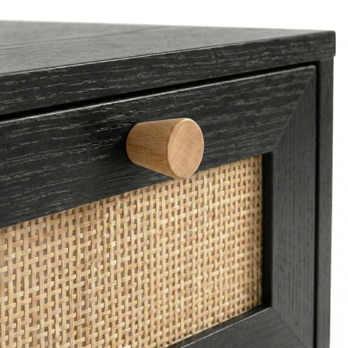 [Black] Wovena chest of drawer close-up detail showing cylindrical wooden knob handle and woven rattan drawer front panel