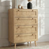 [Oak] Wovena 4-drawer chest styled against a white panelled wall in a bright room, angled view with decor on top