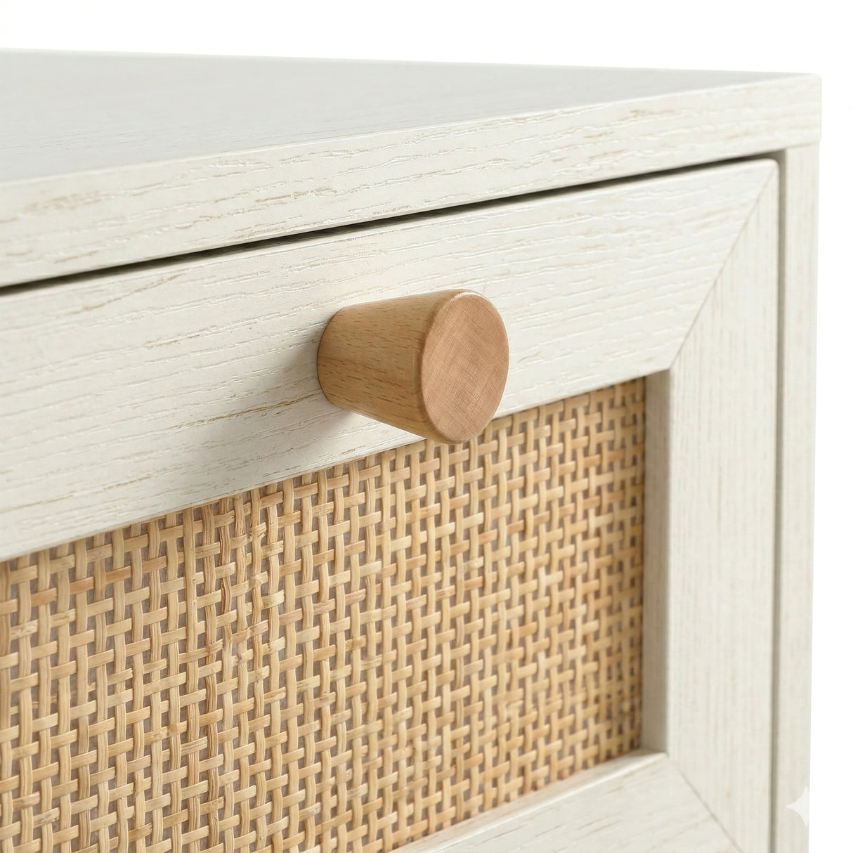 [White] Wovena rattan chest close-up of round natural wood knob on white frame above cane mesh