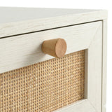 [White] Wovena rattan chest close-up of round natural wood knob on white frame above cane mesh