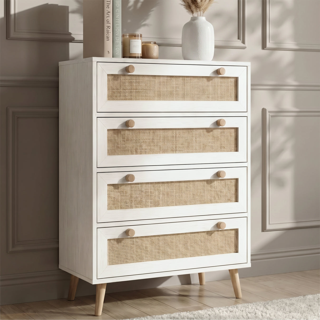 [White] Wovena rattan chest shown from the side, round knobs, tapered pine legs, white melamine body