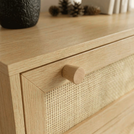 [Oak Effect] Macro of round wooden knob and cane-weave drawer front on Wovena rattan tall chest in oak-effect finish
