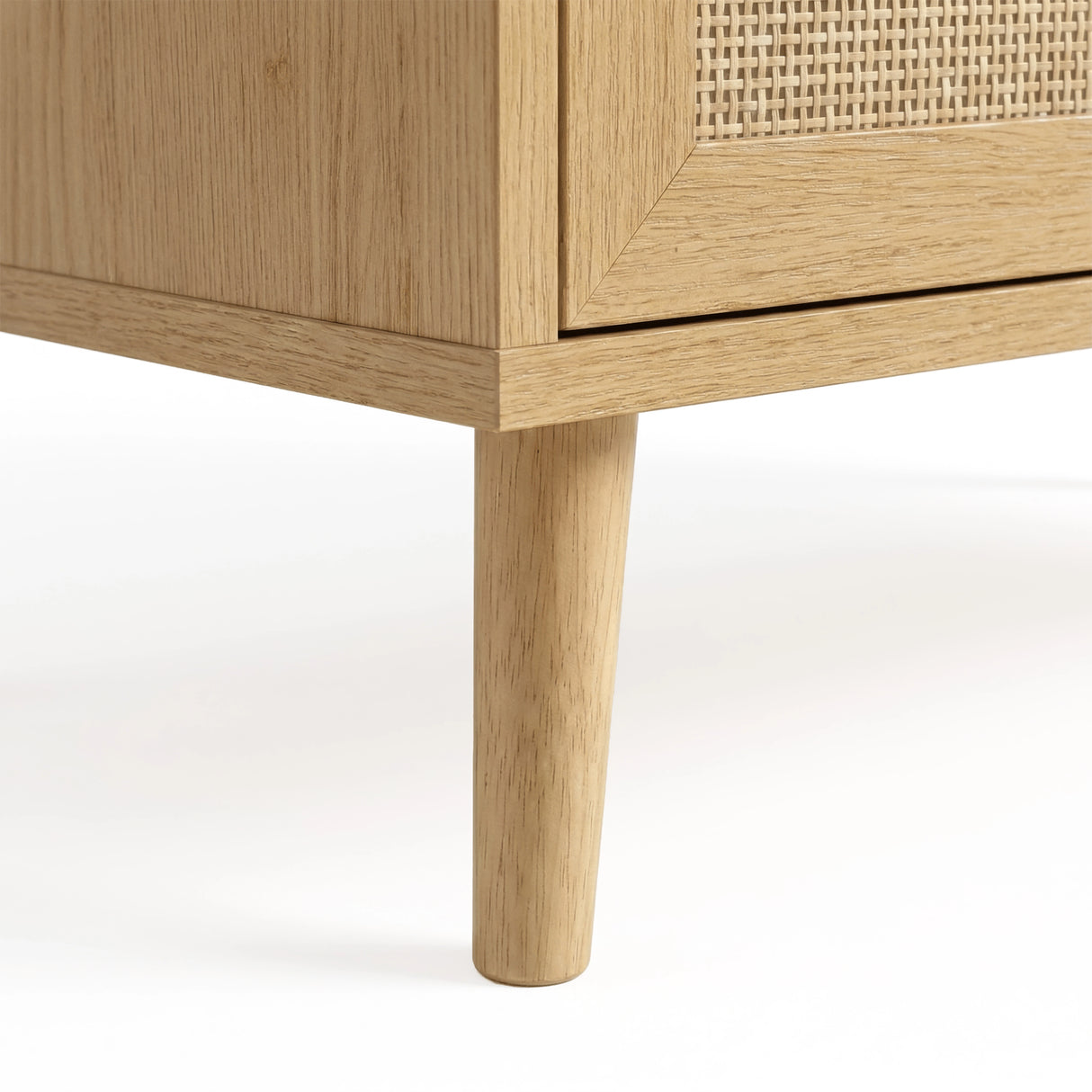 [Oak] Leg close-up showing mid-century tapered profile on oak five drawer chest