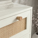 [White] Close-up of natural wood knob and cane panel on white Wovena rattan tallboy chest drawer front